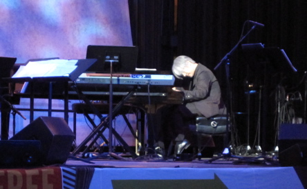 Sakamoto at the piano, performing an untitled solo piece. 