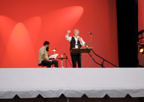 Rhys Chatham, with Hi-Hat player Ryan Sawyer at his side, conducting A Crimson Grail in Damrosch Park. (Copyright 2009, Steven P. Marsh)