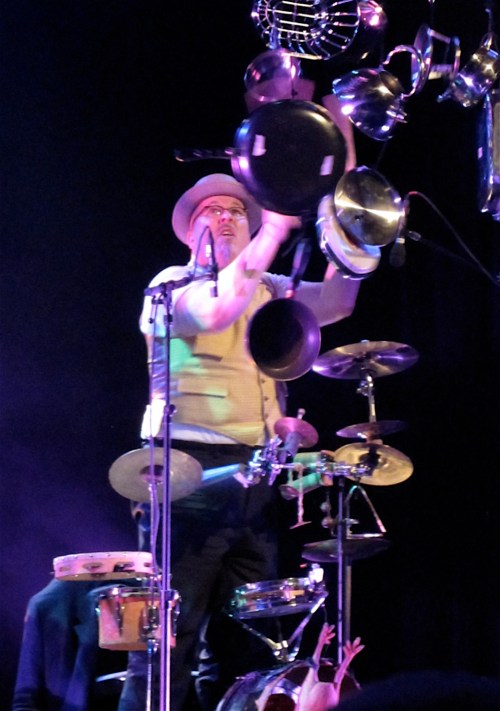 Adrian Huge battles descending pots and pans in "Fidgety Phil," a number from the band's musical Shockheaded Peter. 