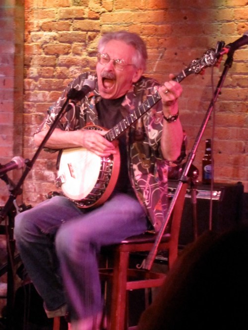 Peter Stampfel torturing a banjo and assaulting our ears at the Gerdes Folk City 50th Reunion in 2010. (Photo 2010, Steven P. Marsh)