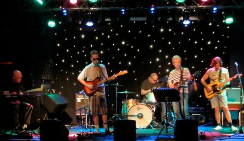 From left, John Baumgartner sits in on keyboards with East of Venus' Glenn Mercer, Stan Demeski, Rob Norris and Michael Carlucci.  (Photo © 2013, Steven P. Marsh)