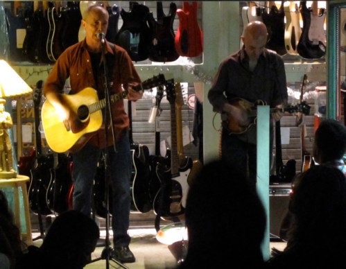 Freedy Johnston, left, with James Mastro at Mastro's Guitar Bar store in Hoboken on June 12, 2010. (Photo © 2010, Steven P. Marsh)
