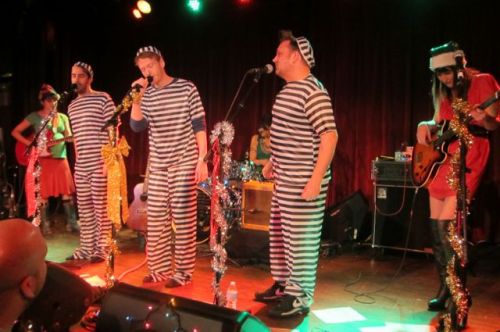 The members of Poundcake got into the spirit by donning appropriate costumes for their performance of 'Christmas in Jail."
