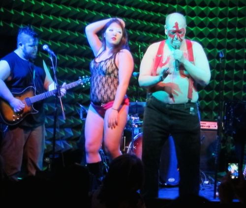 One of the Ubettes dances with Pere Ubu.