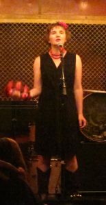 Cynthia Hopkins in a solo performance at Pete's Candy Store, 709 Lorimer St., Williamsburg, Brooklyn, on June 17, 2014. (Photo © 2014, Steven P. Marsh/willyoumissme.com)