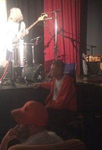 Jonathan Demme at the feet of Feelies bassist Brenda Sauter.